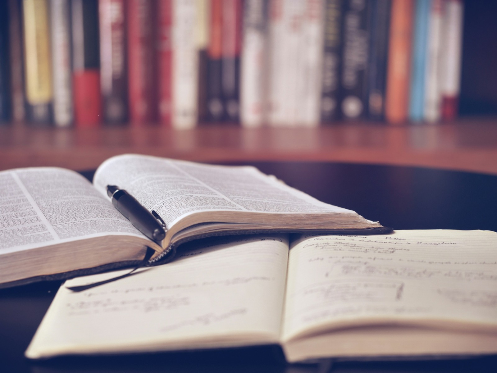 A collection of old books on a shelf.